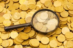 4753345-vMagnifying-glass-and-lots-of-gold-coins-Stock-Photo.jpg