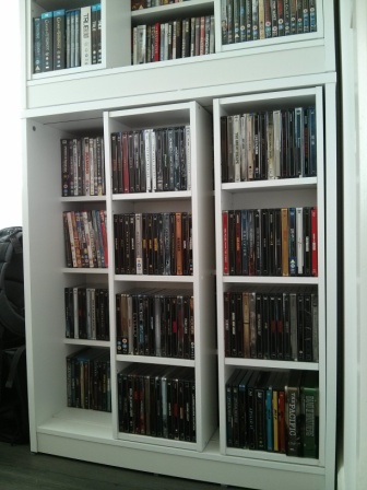 224 Steelbooks front and behind, some DVDs on top shelf behind