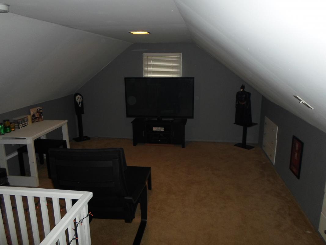 My attic "mancave"..just a place to chill and get some work done, or watch a movie..60" tv and ikea poang chair up here,is all I need,LOL!!..Will post pics of my home theater later!!